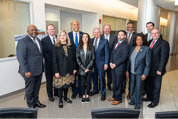 Senators Booker and Menendez pose with Kean's president and state legislators