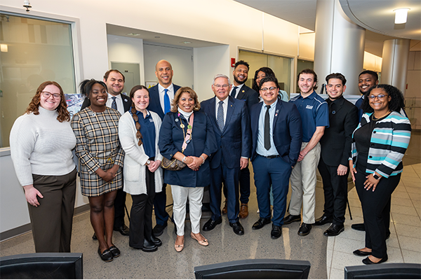 Senators Booker and Menendez pose with Kean students.