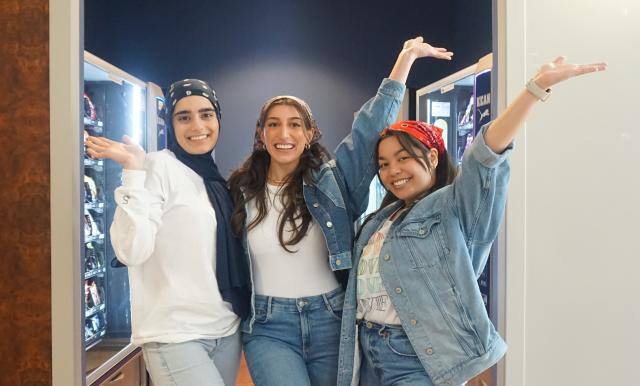 Picture of 3 first year OT students in Hennings Hall 