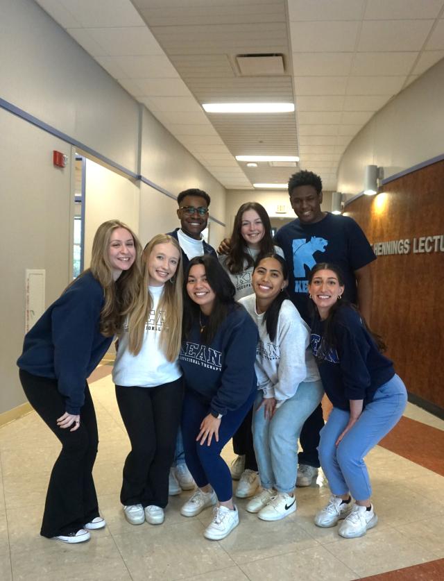 Group photo of first year OT students wearing Kean merchandise in Hennings Hall 