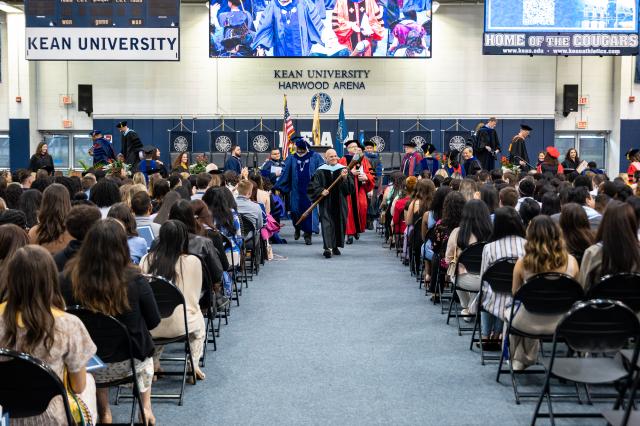 The honors convocation procession is arriving