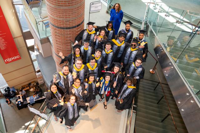 Kean graduates congregate on a staircase