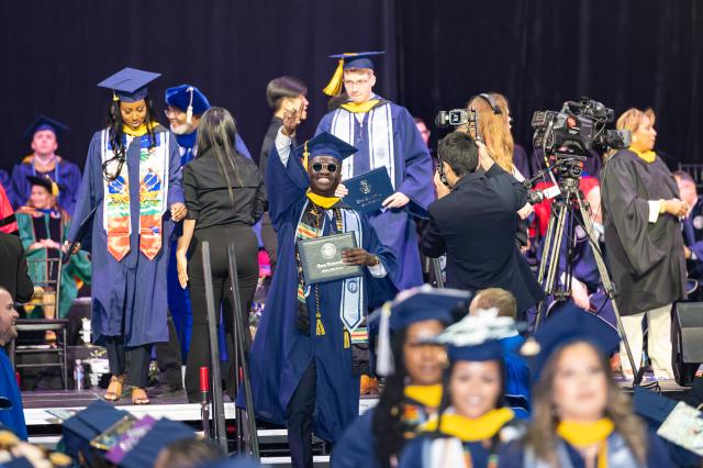 Student leaves stage with degree