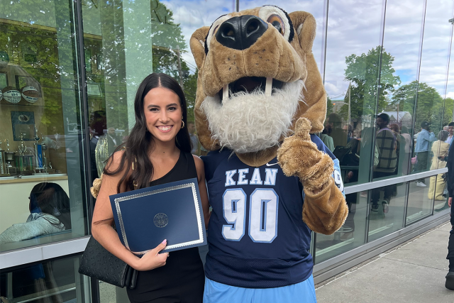 Megan Braine poses with Kean's cougar mascot, Keanu.