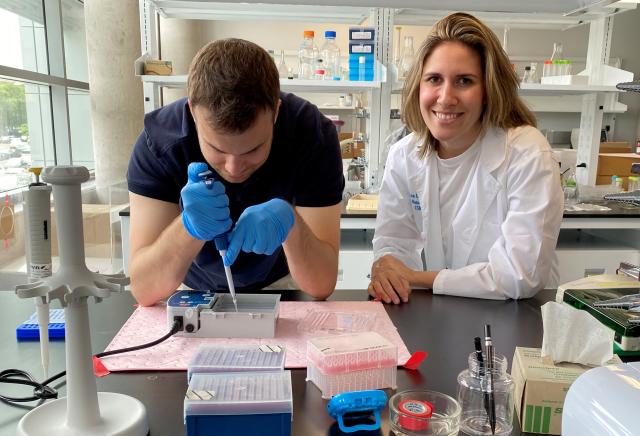 Brenna Levine working in the lab with student Nicolas Largotta, a junior molecular and cell biology major 