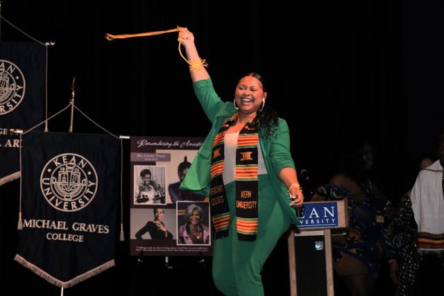 Graduate, Ms. Draper Celebrates walking the stage. 