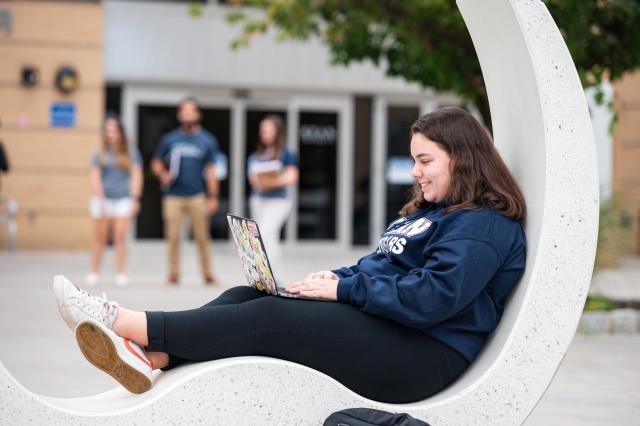 Kean student relaxes on the MSC patio