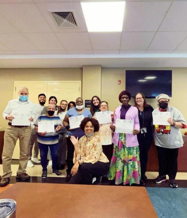 Members of the Housing Authority of the City of Elizabeth gather for a picture with Kean students and Dr. Mulry after the completion of a community-based group