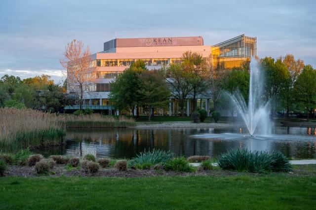 STEM Building at dusk with fountain