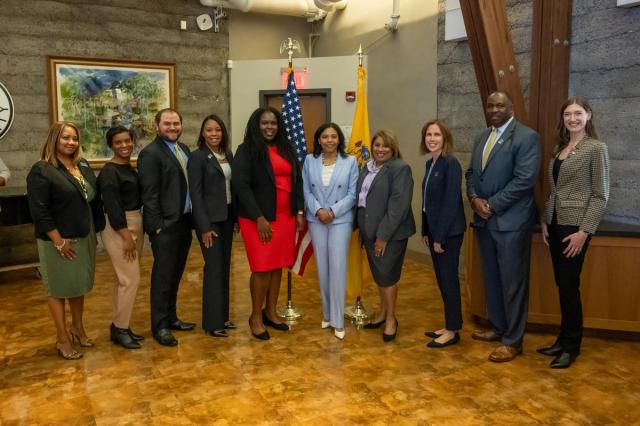 Acting Governor Tahesha Way poses with Kean University staff.