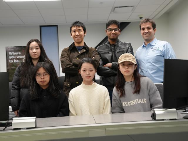 Six students and their professor in the Bloomberg Lab at Kean's CBPM.