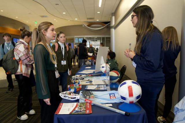 Students network with sports professionals