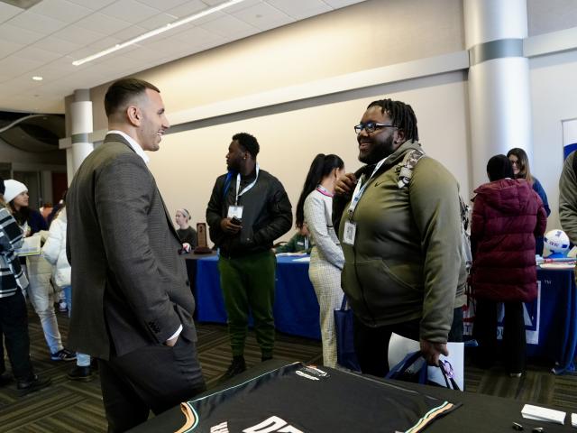 Attendees network at the Kean Sports Summit