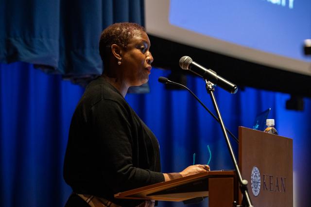 Barbara George Johnson speaks at a podium at Kean