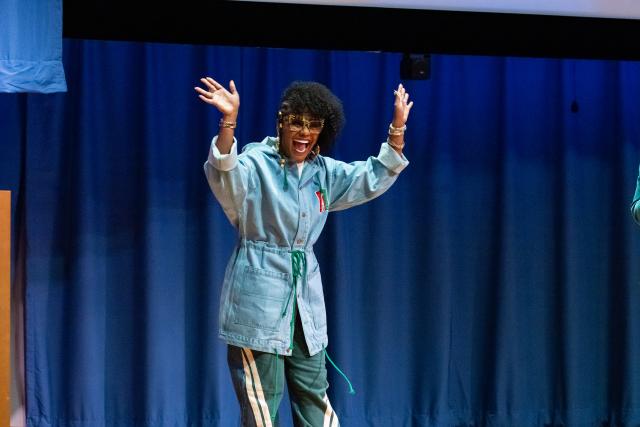 tabitha brown, wearing casual clothes, waves to the crowd