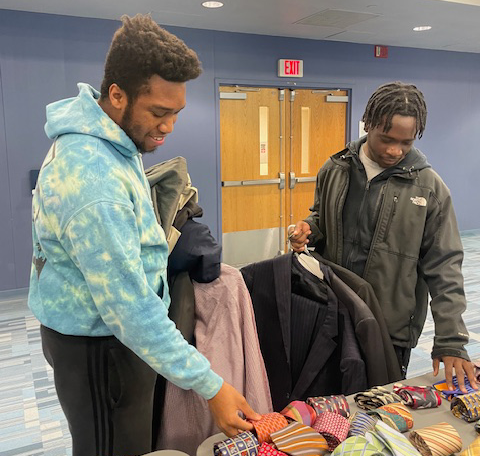 Students shop professional attire in the Cougar pop up shop