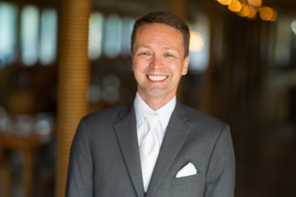 Nate Rigel in a posed shot in suit