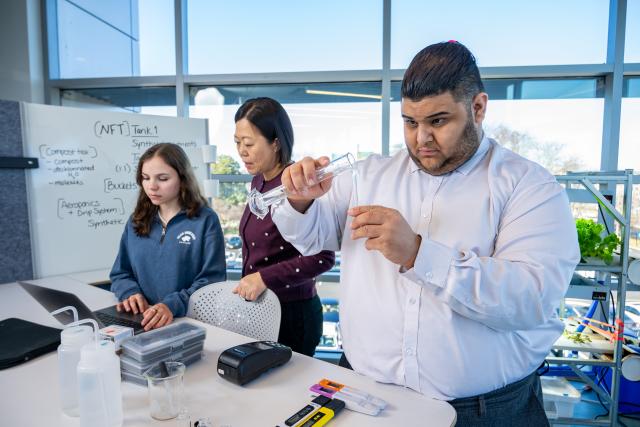 Kean students conduct a hydroponic agriculture experiment in a campus laboratory