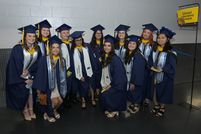 A group of graduating students pose before Kean University's Undergraduate Commencement begins.