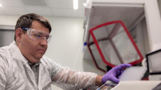 Lance Marquardt is working in a lab