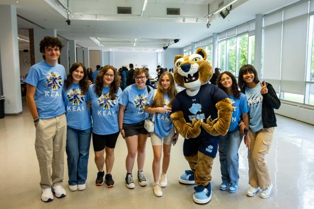 Keanu the Cougar poses with new students