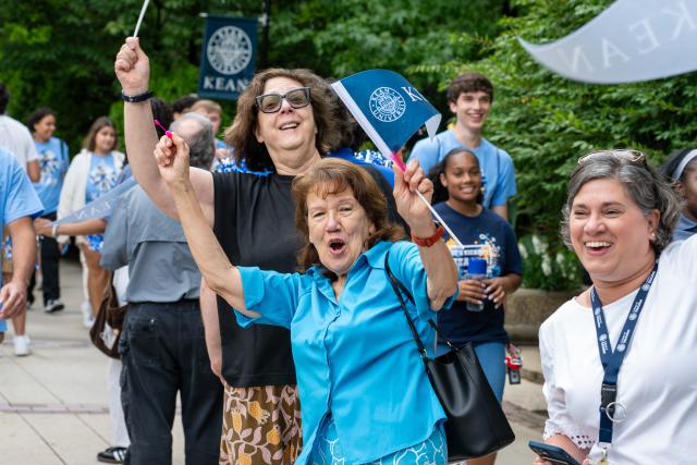 Staff and faculty cheer on the newest Kean Cougars