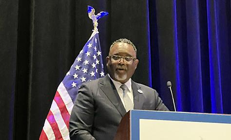 Kean President Dr. Lamont O. Repollet at podium at 2024 DNC Caucus