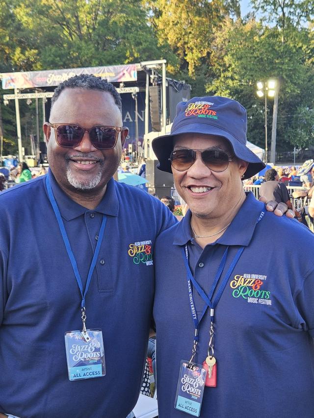 Griot and Repollet dressed in blue at the festival