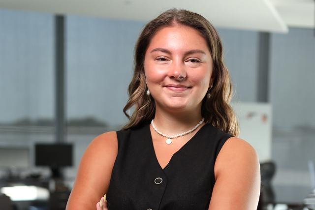 Kean 2025 valedictorian Sophia Sacewicz poses with arms crossed, smiling
