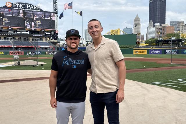Tyler Smarslok and Stephen Strom post together on the field of the Miami Marlins baseball team.