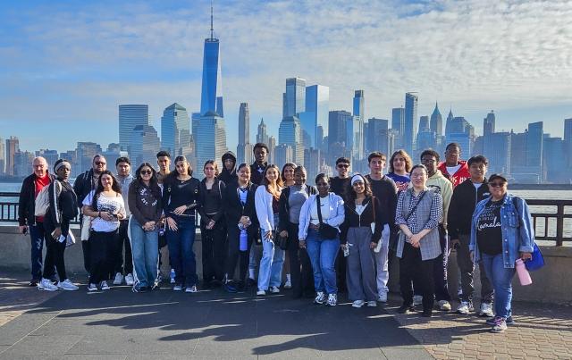 Learning Community student members from 2024 stand in front of NYC skyline