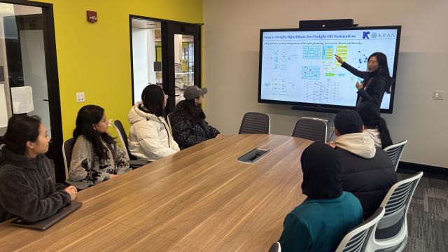 Dan Liu in a classroom teaching students