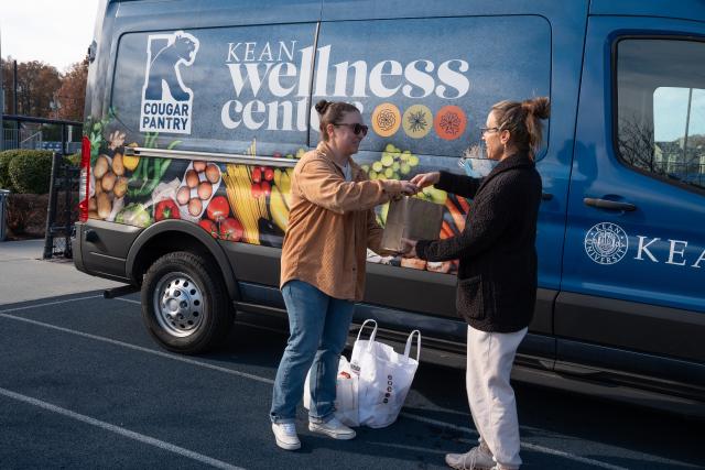 Cougar Pantry taking donations in front of van