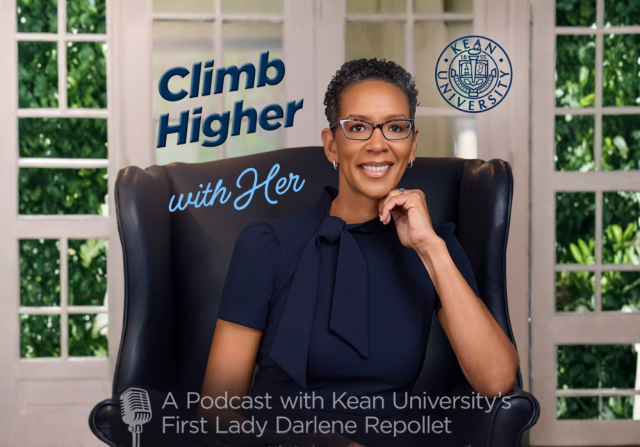 Climb Higher with Her podcast with Darlene Repollet. A woman with glasses dressed in navy blue seated in front of a window. 