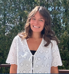 Picture of women with brown hair smiling at camera.