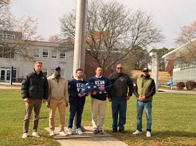 Kean Veterans at a flag raising ceremony