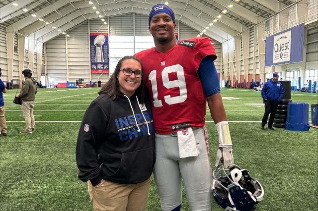 Woman and football player on a football field 