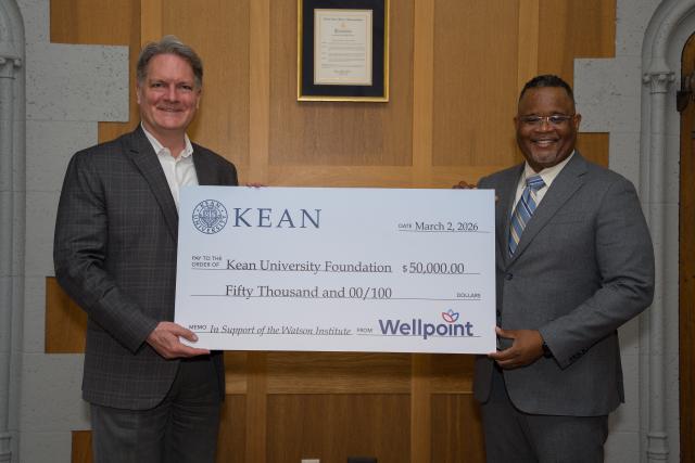 Oversized check presented to Kean University President Lamont O. Repollet