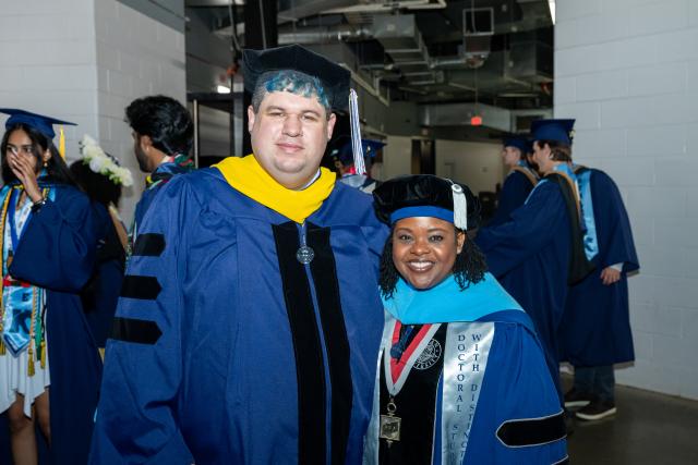 Two Kean doctoral students pictured at Kean's 2026 commencement ceremony