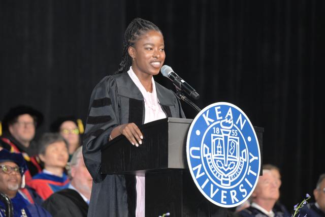Woman speaking at a stage