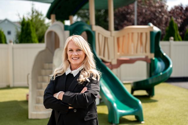 Woman standing in front of a playground set