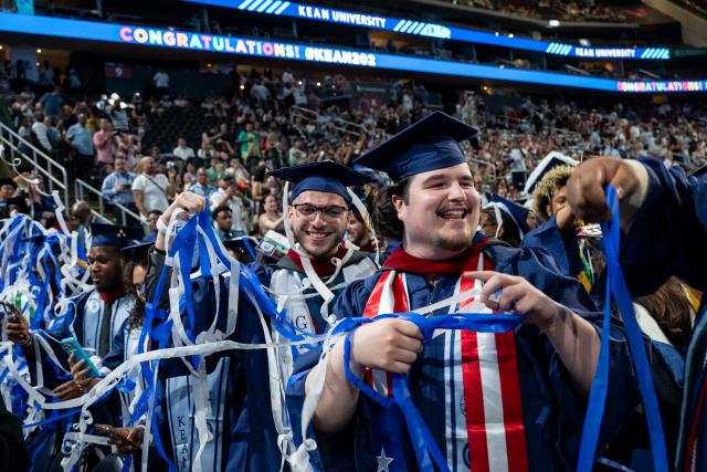 Grads play with confetti