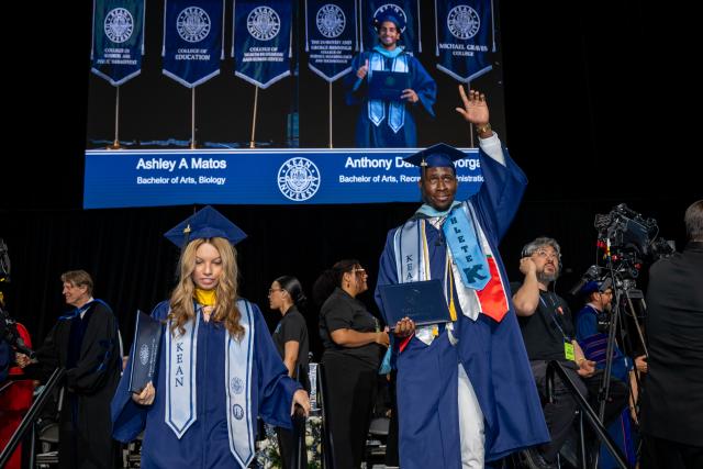 A student athlete clutches his diploma