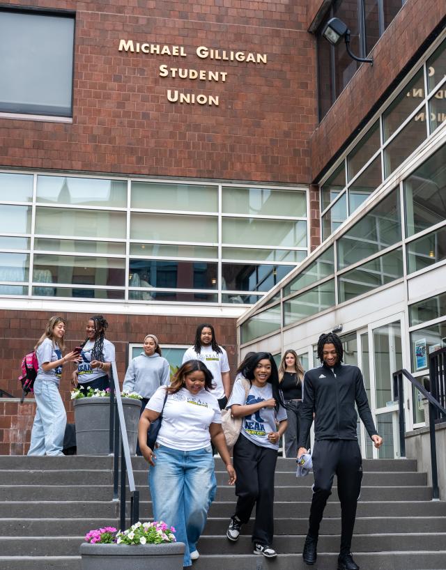 Kean Jersey City students gather on the steps of the Michael Gilligan Student Union