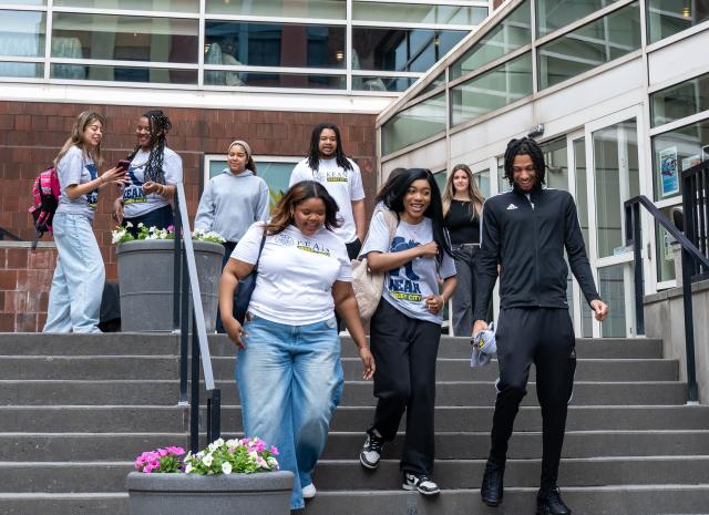 A group of students on the steps of Kean Jersey City