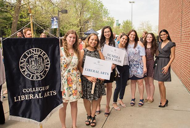 students lining up with their school banner for honors convocation