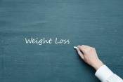 Blackboard with hand writing "Weight Loss" (presentation title)