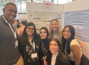 Raising Families research group next to their poster at Kean Research Days