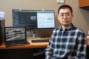 Kean researcher Kuan Huang is pictured in his office